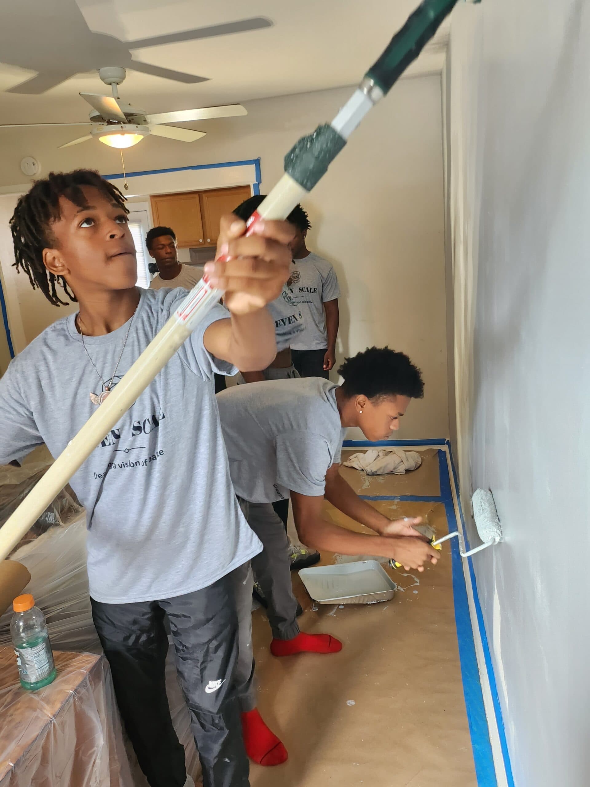 Apprentice putting his painting skills to work.